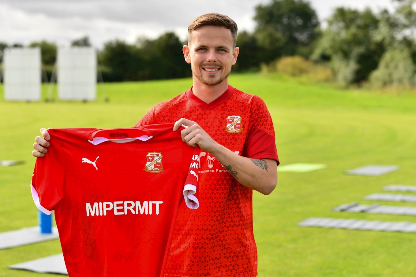 Swindon Town confirm their first permanent signing of the summer